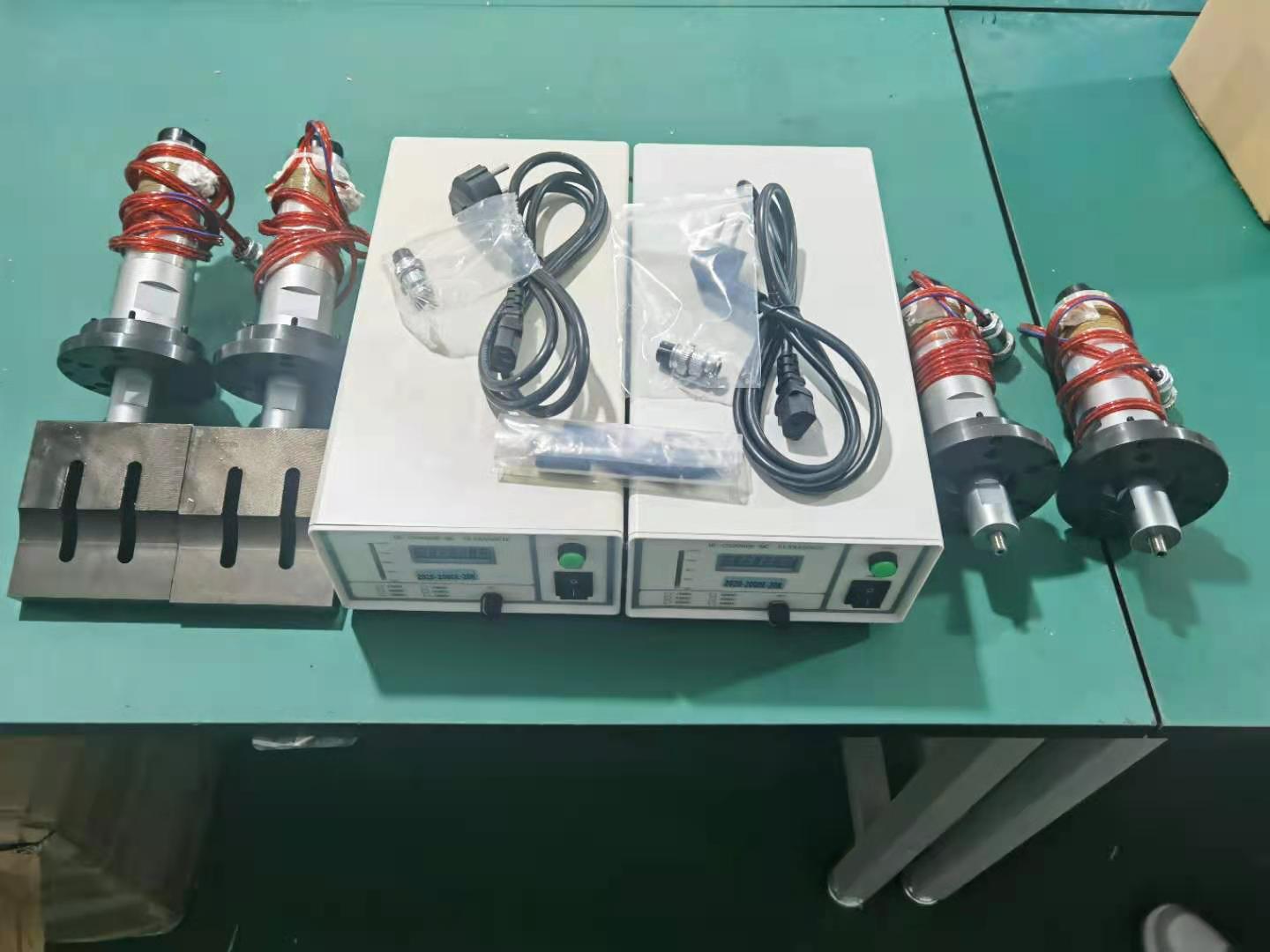 A complete ultrasonic welding generator and transducer set: two generators, four transducers, horns and cables