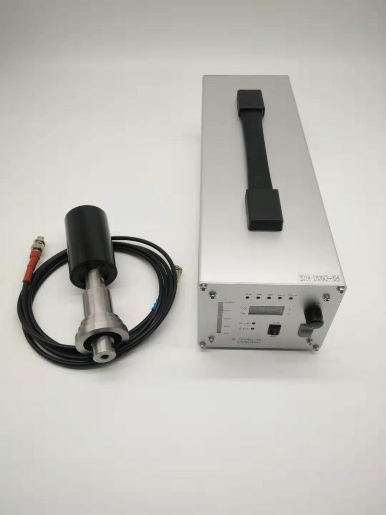 Ultrasonic generator, transducer and cable set on the bench before the frequency sweep